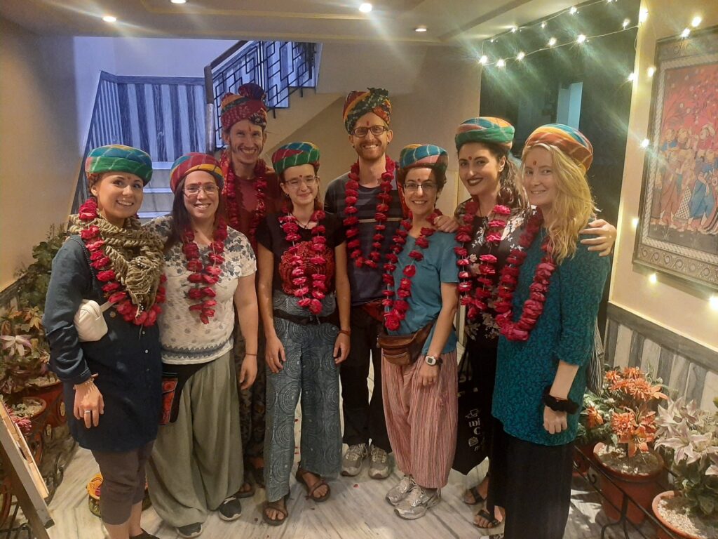 interns and volunteers wearing garlands and pagdi